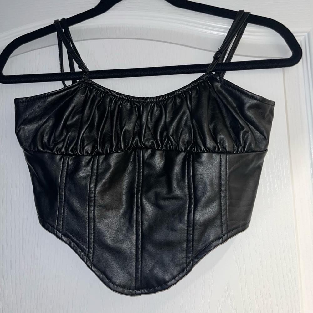 Faux leather corset like top.